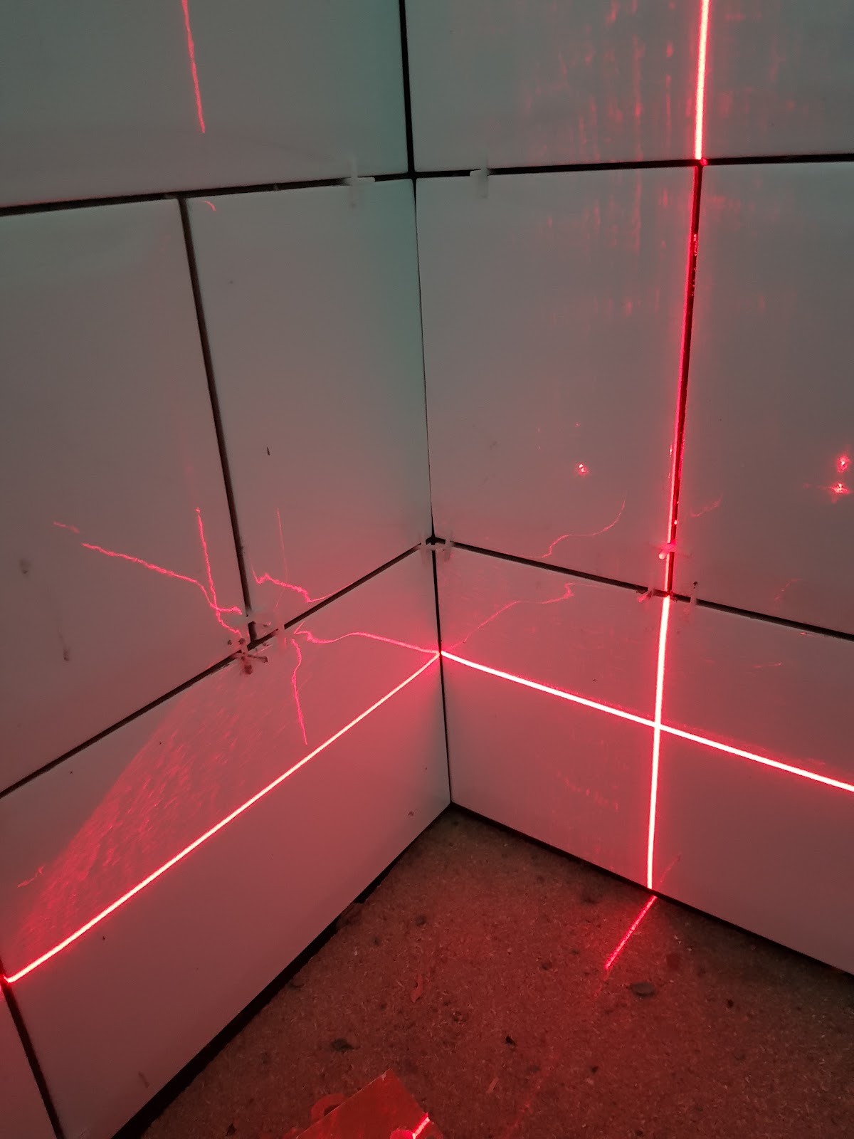 Laser lines used to align bathroom wall tiles